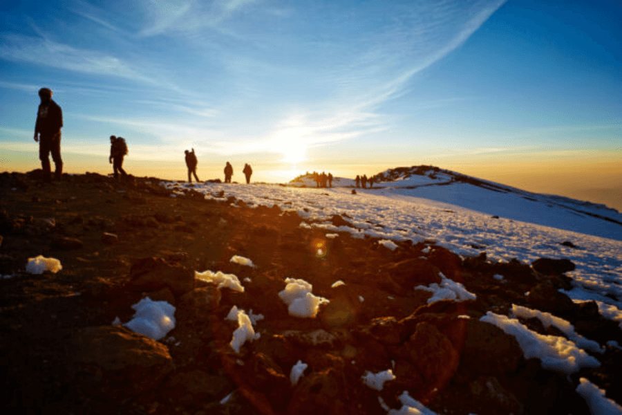 Hikers ascending Mount Kilimanjaro from the Arusha safari gateway, Tanzania’s iconic adventure destination.